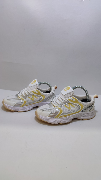 کفش بچگانه نیو بالانس سفید زرد نقرهای